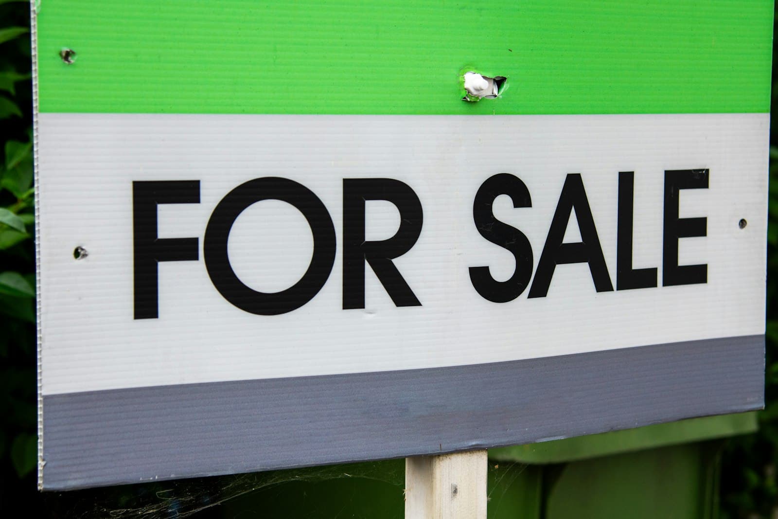 A "for sale" sign outside a house